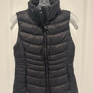 Ladies black North Face puffer vest. Size XS